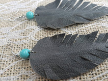 Long grey feather earrings