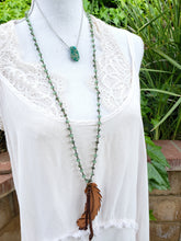 Green beaded feather necklace