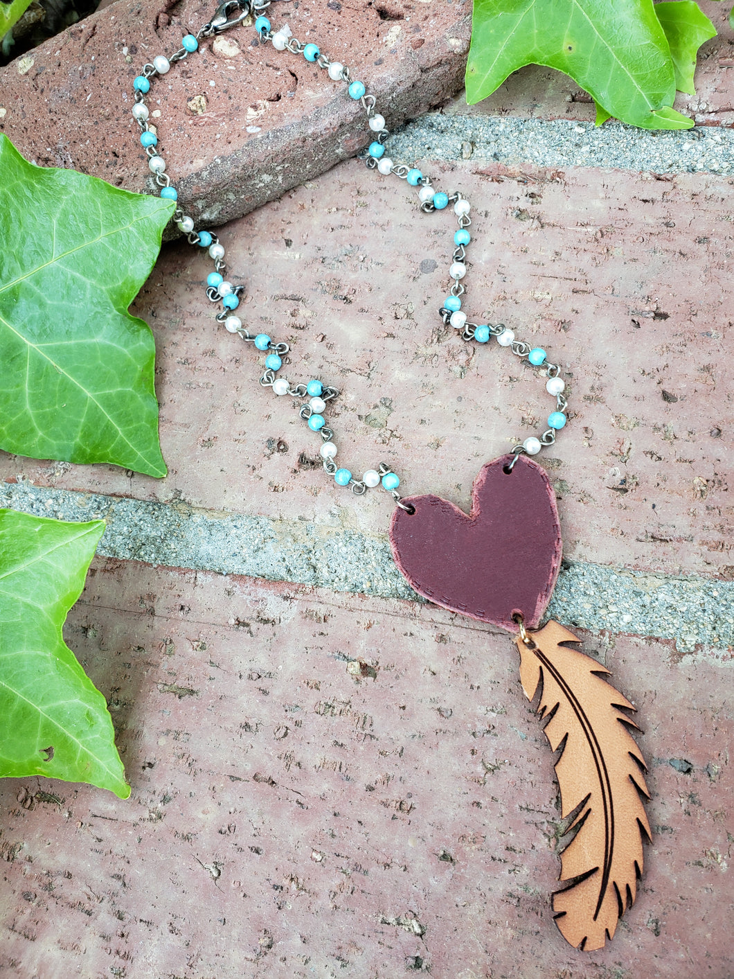Red heart and feather necklace