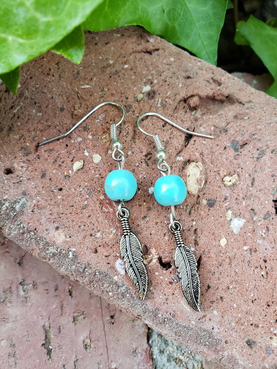Turquoise beaded feather earrings
