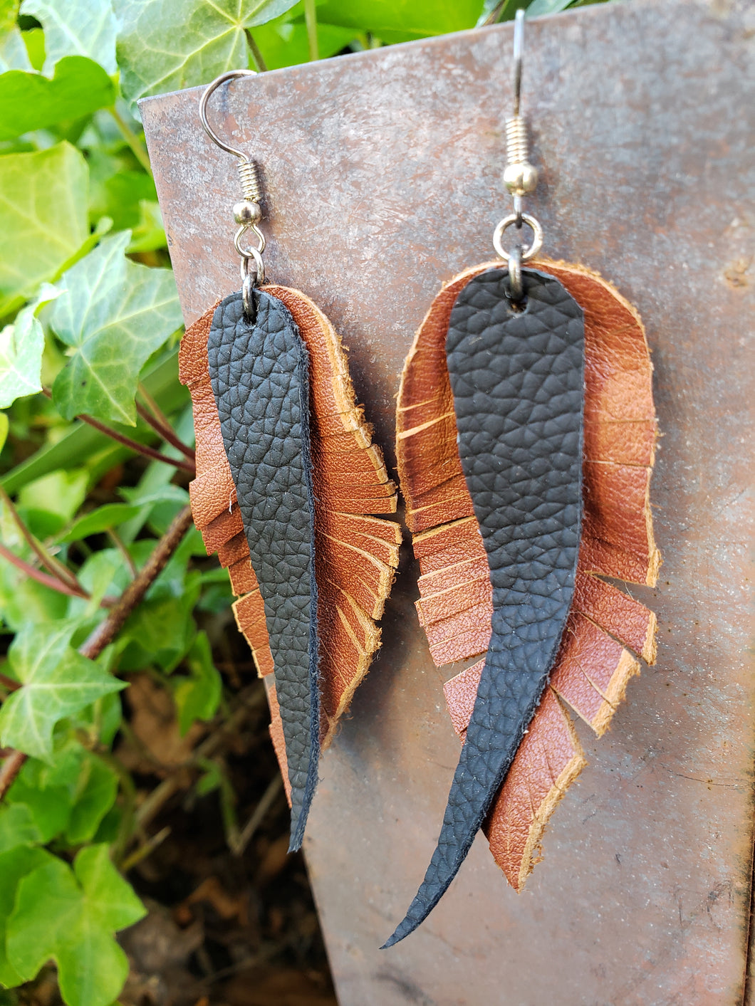 Black and brown leather feather earrings