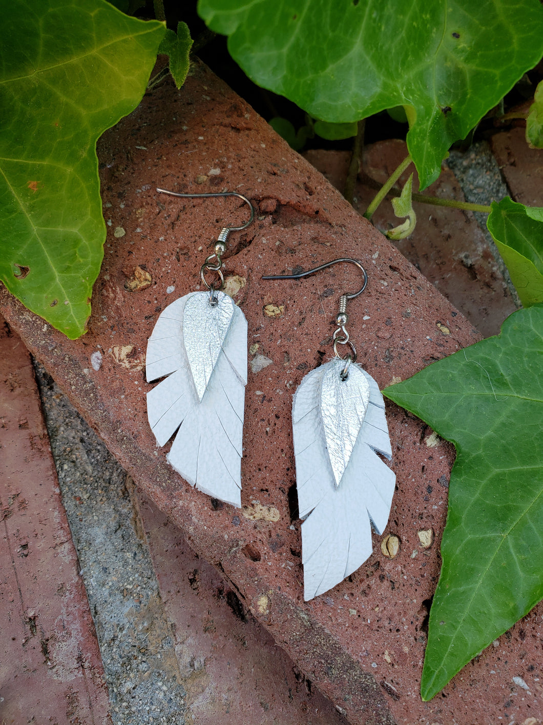 White leather feather earrings