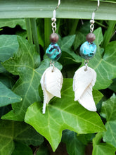 White feather dangle earrings