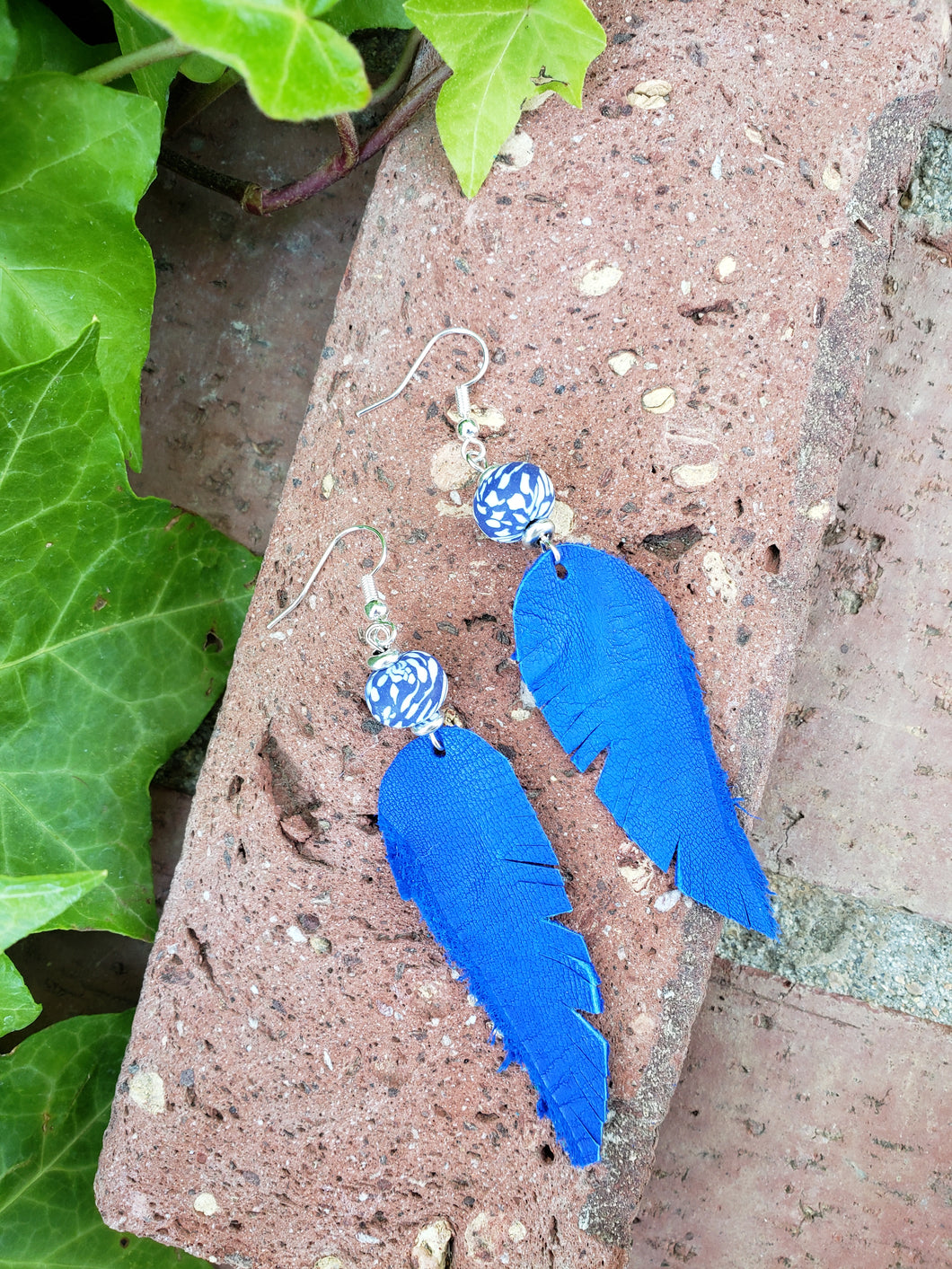 Brilliant blue feather earrings