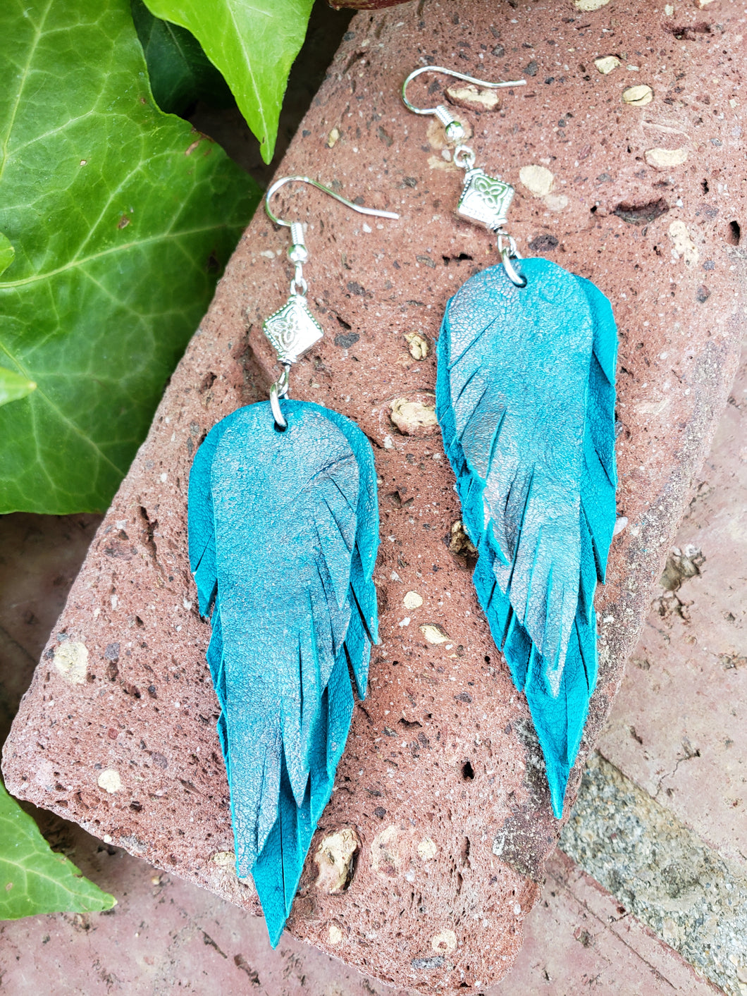 Metallic teal feather earrings