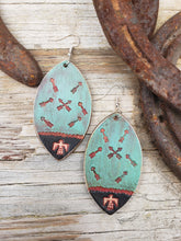 Thunderbird tooled leather earrings