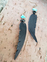 Black leather feather dangle earrings